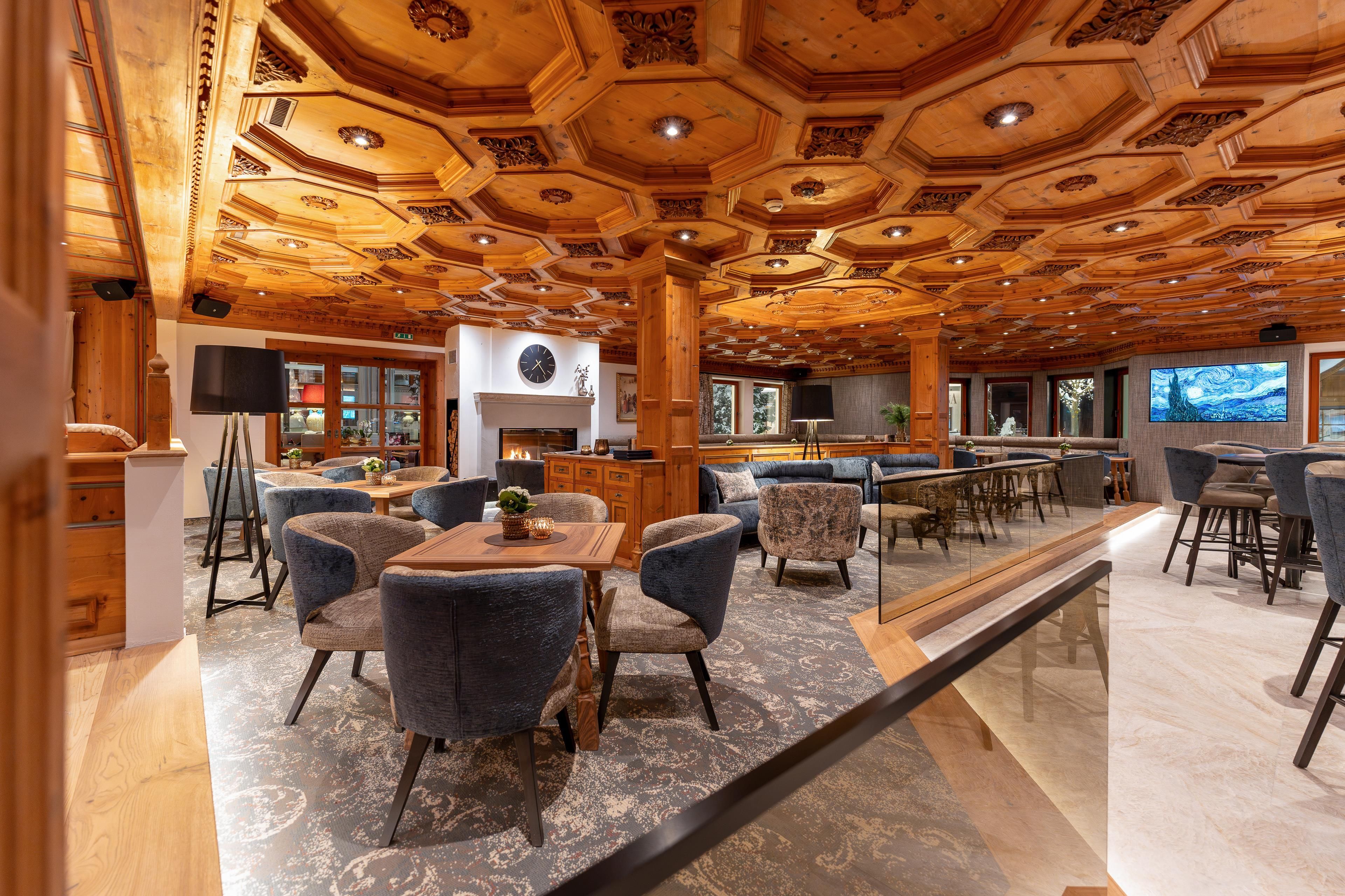 A cozy restaurant with a wooden ceiling and modern furniture. The decor invites you to linger.